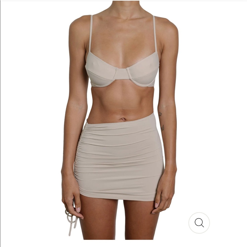 Brand new with tags riot swim bikini top, bottom, and matching skirt.